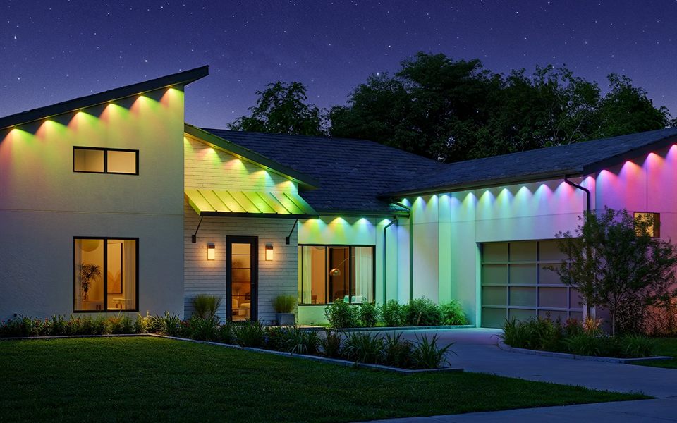 Modern home with color lights along the roofline